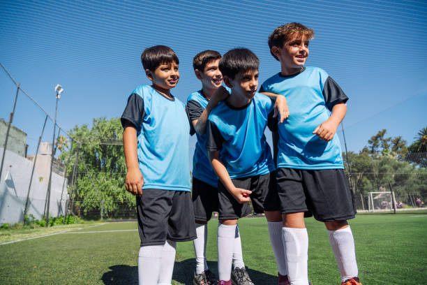 istock Young Soccer Team Standing Together on the Field Smiling 1992143088