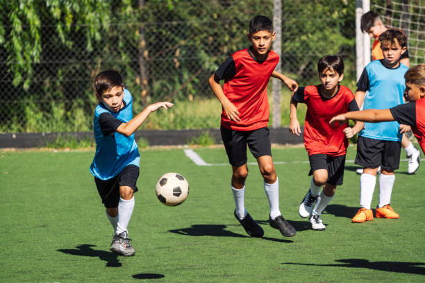istock Young Soccer Players Practicing on Field During Team Sports Event 1992144648