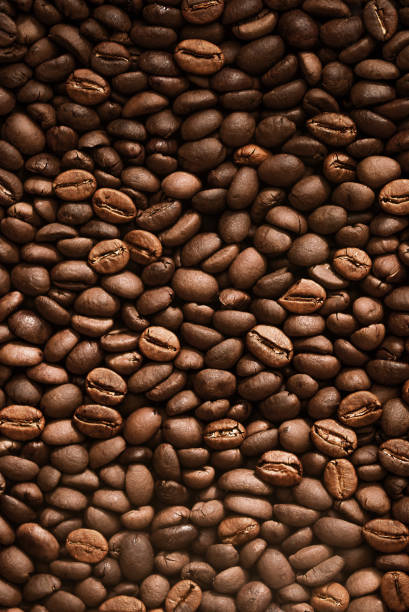 Fresh Roasted Coffee Beans Rustic Background. Coffee Beans in a pile