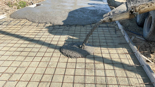 istock Pouring concrete on reinforced concrete roads using a ready-mix cement truck. 1992146762