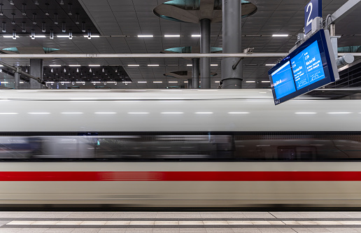 Modern speed passenger train on railways station.