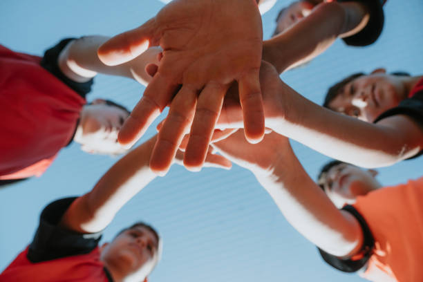 istock A low angle shot capturing a youth soccer team's hands together 1992149478