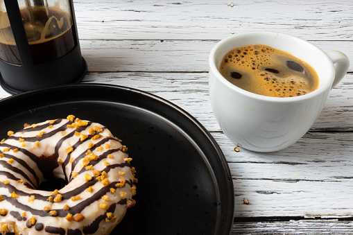 Doughnut on a plate and coffe