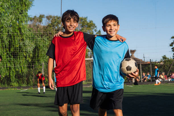 istock Happy Young Soccer Players Smiling on Field After Game 1992155806