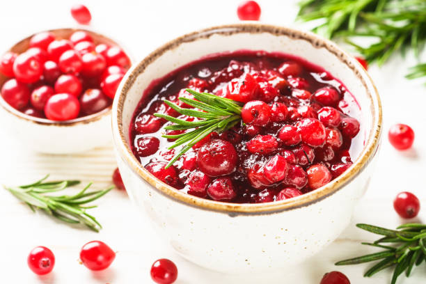 istock Cranberry sauce in a bowl on white table. 1992165389