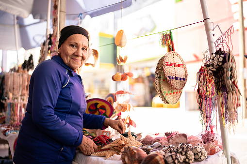 Portrait of a senior woman on street market