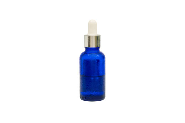 istock Serum contained in blue glass bottle isolated on white background with clipping path. 1992173911