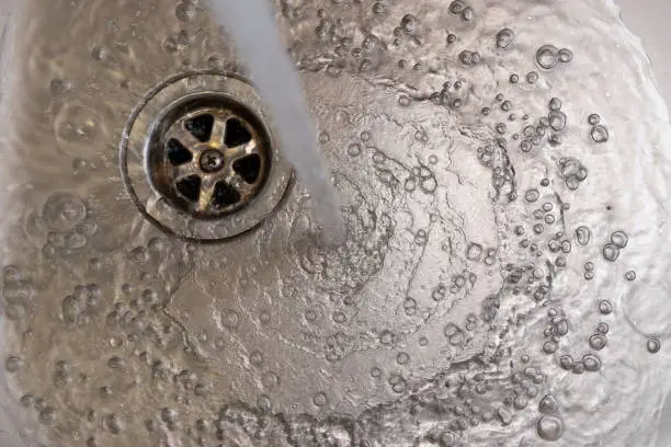 Plughole and water