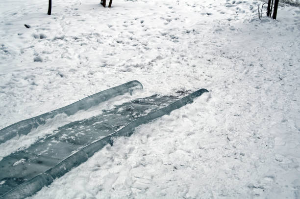 A sleigh positioned at the top of a snowy hill on a winter day. Outdoor play, seasonal activity, childhood adventure, winter recreation, and cold weather lifestyle.