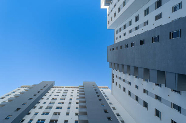 Low angle view of apartment building against clear sky