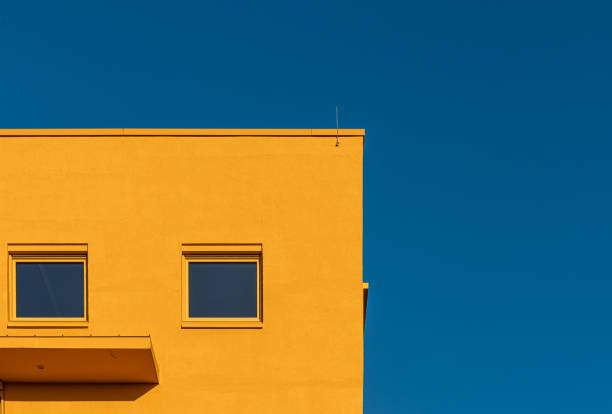 istock Yellow building against clear blue sky 1992187753
