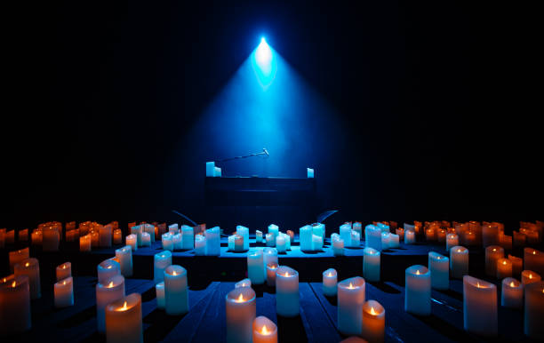 istock piano on stage with lots of candles 1992191452