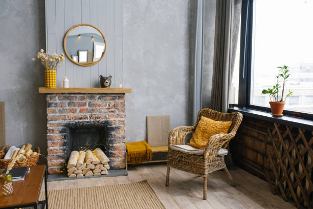 istock Modern interior with decorative fireplace and rattan chair, Scandinavian style. 1992201688