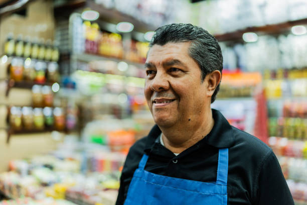 istock Mature salesman selling at market 1992207163