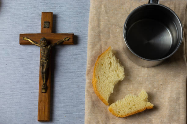 istock Lent - crucifix, bread and water 1992216100