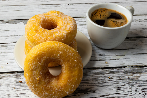 Doughnuts and coffee on a table