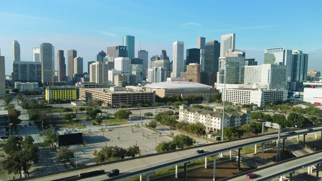 Establishing Shot Houston. Panoramic Cityscape of Houston Downtown, Toyota Center Stadium, Aerial Drone Skyline above Interstate Freeway 69 (I69), Texas Freeway 56