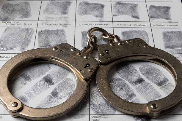 istock Fingerprint card and handcuffs 1992222489