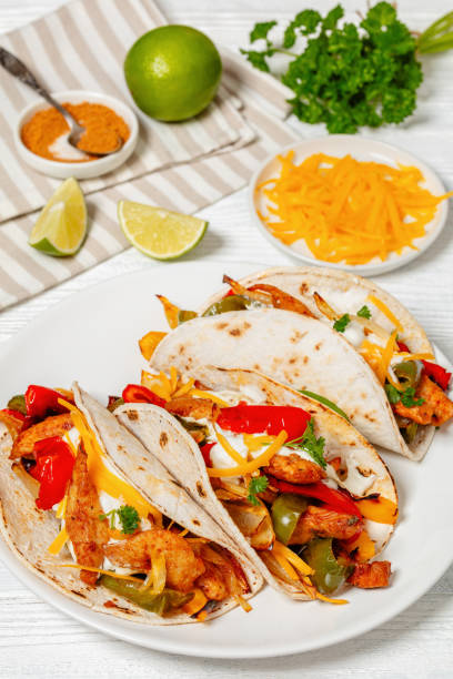 istock baked tex-mex chicken fajitas on a plate, top view 1992223533