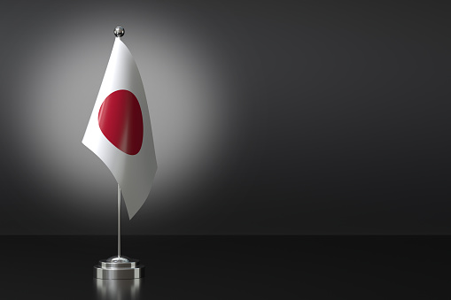Small Japan Flag in Front of Black Background, 3d Rendering