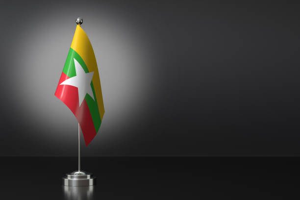 istock Small Myanmar Flag in Front of Black Background, 3d Rendering 1992229915
