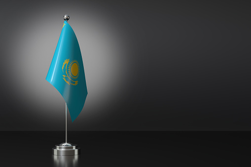 Small Kazakhstan Flag in Front of Black Background, 3d Rendering