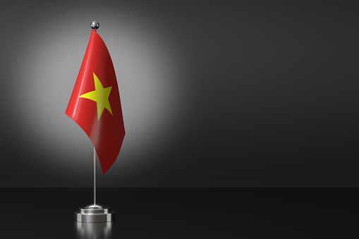 Small Socialist Republic of Vietnam Flag in Front of Black Background, 3d Rendering