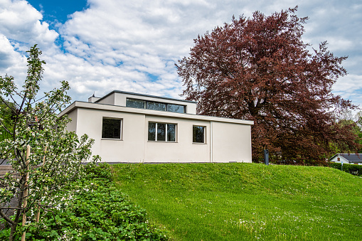 Weimar, Germany - May 12, 2023: Haus am Horn building in Weimar, Germany with grass lawn. Haus am Horn is the only truly Bauhaus building in Weimar.