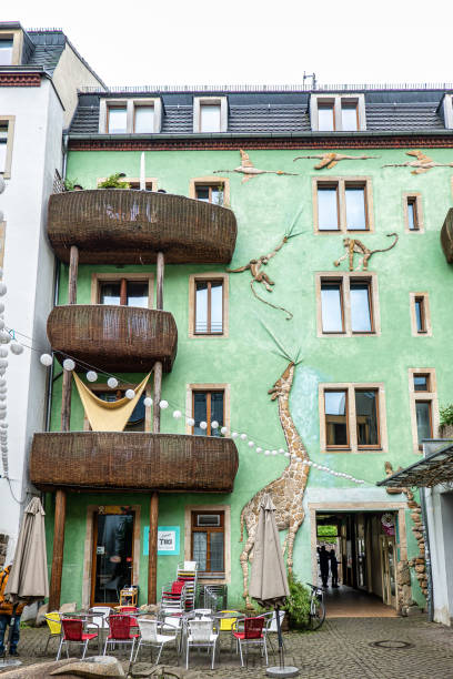 Dresden, Germany - May 16, 2023: Kunsthof passage in Neustadt district of Dresden, Germany. Kunsthofpassage is a set of inner courtyards rejuvenated with modern art and quirky restaurants.