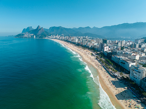 Aerial view of Ipanema beach and Leblon. People sunbathing and playing on the beach, sea sports. Rio de Janeiro. Brazil