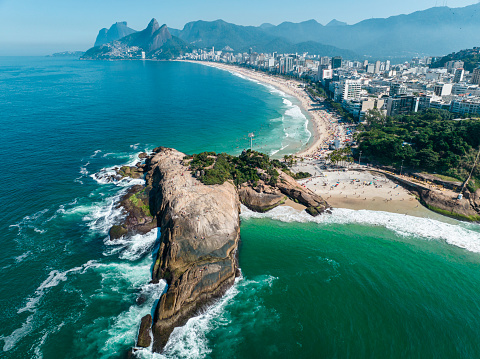 Aerial view of Diabo beach and Ipanema beach, Pedra do Arpoador. People sunbathing and playing on the beach, sea sports. Rio de Janeiro. Brazil