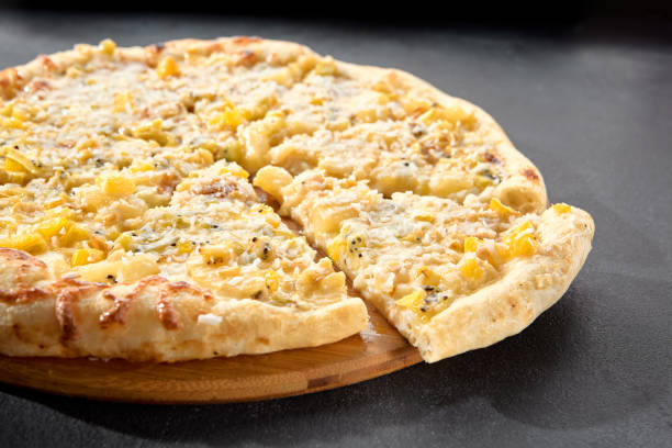 Four cheese pizza with a rich blend of creamy and flavorful cheeses on a golden crust, an Italian classic