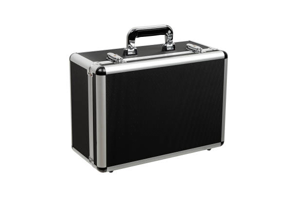 istock Black padded aluminum briefcase case with metal corners.  Case with foam inside. Isolate on a white background. 1992259125