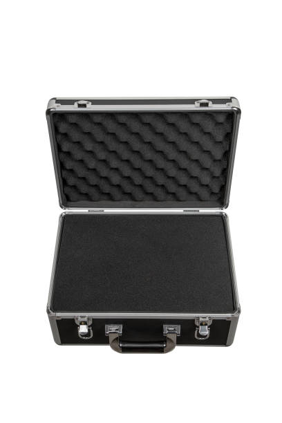 istock Black padded aluminum briefcase case with metal corners.  Case with foam inside. Isolate on a white background. 1992259130