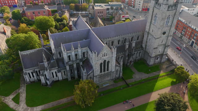 Aerial view of cathedral and park from Saint Patrick's Park-Dublin, Aerial view of historic St. Patrick's Cathedral in the heart of Ireland, Christ Church Cathedral, Aerial view of people walking in saint Patrick park, Public park fountain