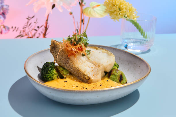 istock Halibut steak with pumpkin puree and broccoli, ideal for a vibrant summer menu in a high-end eatery 1992273534