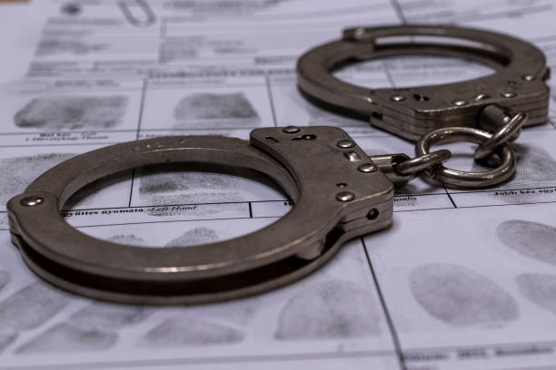 istock Handcuffs and fingerprint card 1992275198