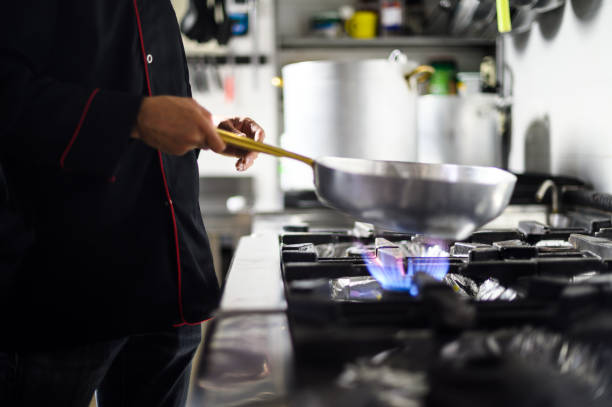 istock Closeup of a chef jumping verdures ina pan 1992282021
