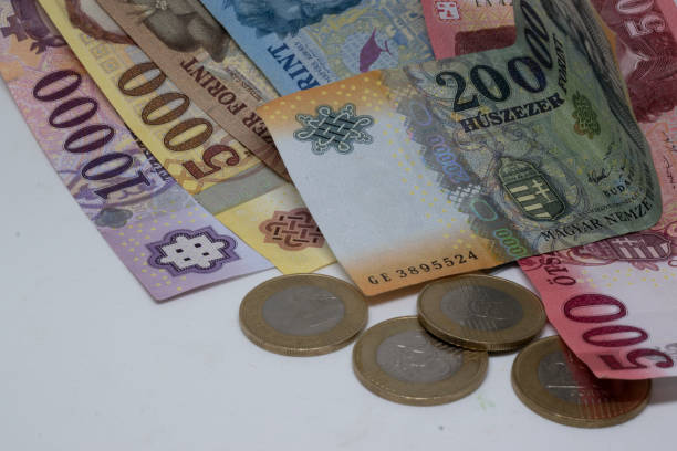 istock Hungarian banknotes and coins on a table 1992290891