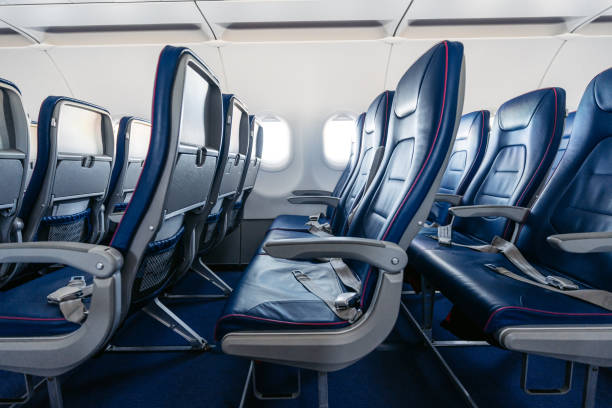 Empty Airplane Seats Empty seats in an airplane. reclining car seats stock pictures, royalty-free photos & images