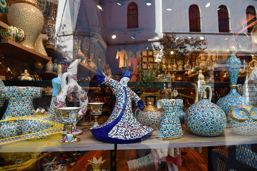 Istanbul, Turkey - December 10, 2023: Showcase of a souvenir shop with traditional Turkish national crafts. Dancing Dervish and various other products