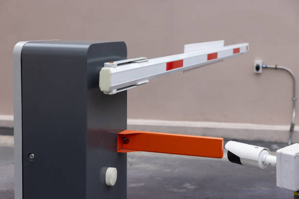istock automatic barrier for home village security system. Automatic barrier arm for car park of resident. 1992313340