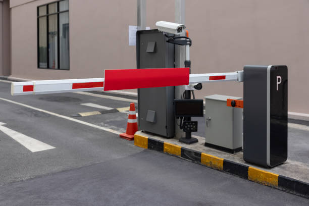 istock automatic barrier for home village security system. Automatic barrier arm for car park of resident. 1992313343