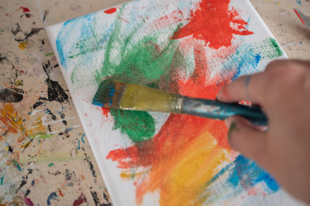 istock painting lessons, canvas with paints, brushes and other elements for painting 1992338187