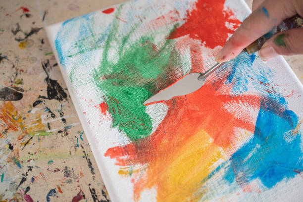 istock painting lessons, canvas with paints, brushes and other elements for painting 1992338189