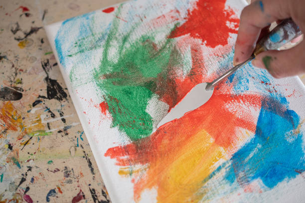 istock painting lessons, canvas with paints, brushes and other elements for painting 1992338195