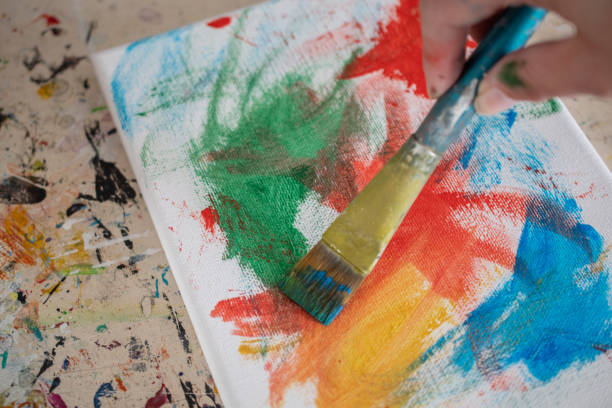 istock painting lessons, canvas with paints, brushes and other elements for painting 1992339260