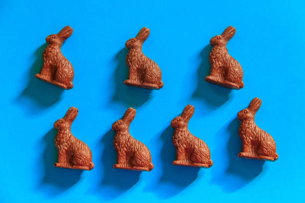 istock Easter chocolate bunnies on blue background. Top view 1992345762
