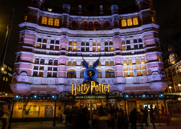 London. UK- 02.04.2024. A night time view of the facade of the Palace Theatre hosting the show Harry Potter and the Curse Child.