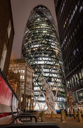 London. UK-02.02.2024. A night street view of 30 St. Mary Axe, nicknamed The Gherkin in The City of London.